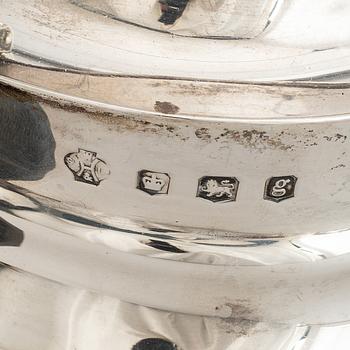 A silver teapot, coffee pot and a hot water pot, including Atkins Brothers, Sheffield 1944.