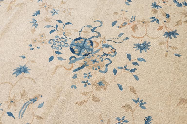 A semi-antique China/Nepal carpet, c, 385 x 297 cm.