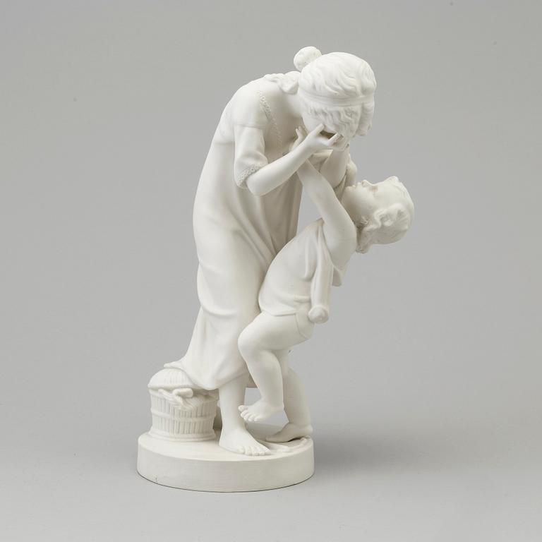 A biscuit figure of a woman and a boy, Gustafsberg, early 20th Century.