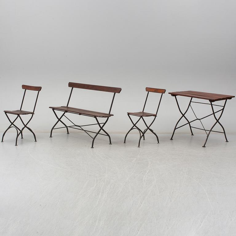 A garden sofa, table and a pair of chairs, first half of the 20th century.