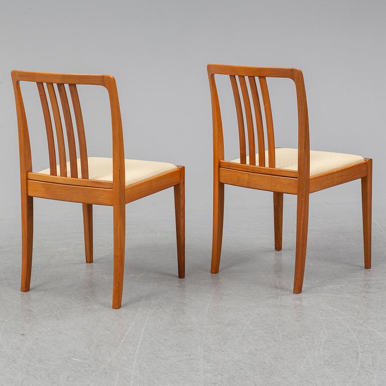 A 1950/60s teak and valnut table and four chairs.