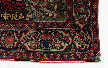 A figural oriental rug, c.. 230 x 130 cm.