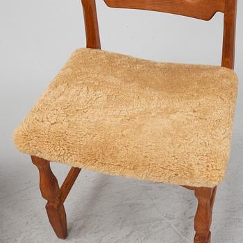 Henning Kjærnulf, a set of six oak 'Razorblade' chairs with new sheepskin upholstery, Nyrups, Denmark, 1960s.