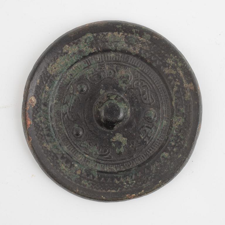 A Chinese bronze mirror, Han dynasty (206 BC-220 AD).