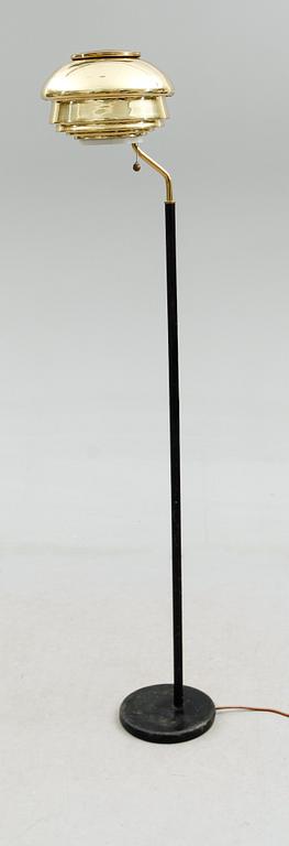 An Alvar Aalto 'A 808' brass and black leather floor lamp, Valaisinpaja, Finland late 1970's.