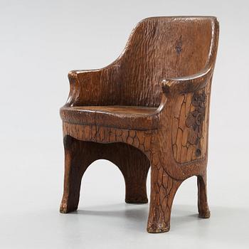 A Gustaf Fjaestad Art Nouveau carved pine chair, 'Stabbestol', by Adolf Swanson, Arvika, Sweden 1908.