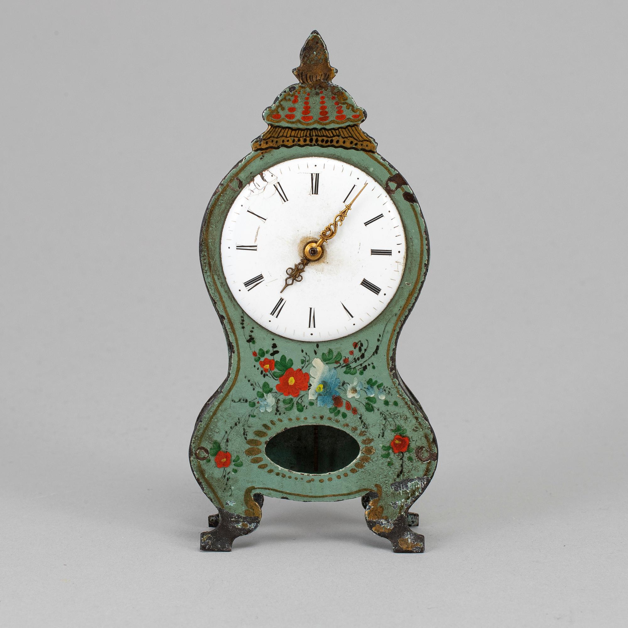 A 19th century tin plate miniature table clock.