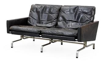 65. A Poul Kjaerholm black leather and steel base "PK-31-2" sofa, maker's mark E Kold Christensen, Denmark.