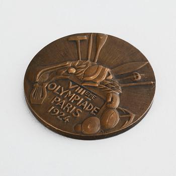 A third plaze bronze medal from the 1924 olympic games in Paris.