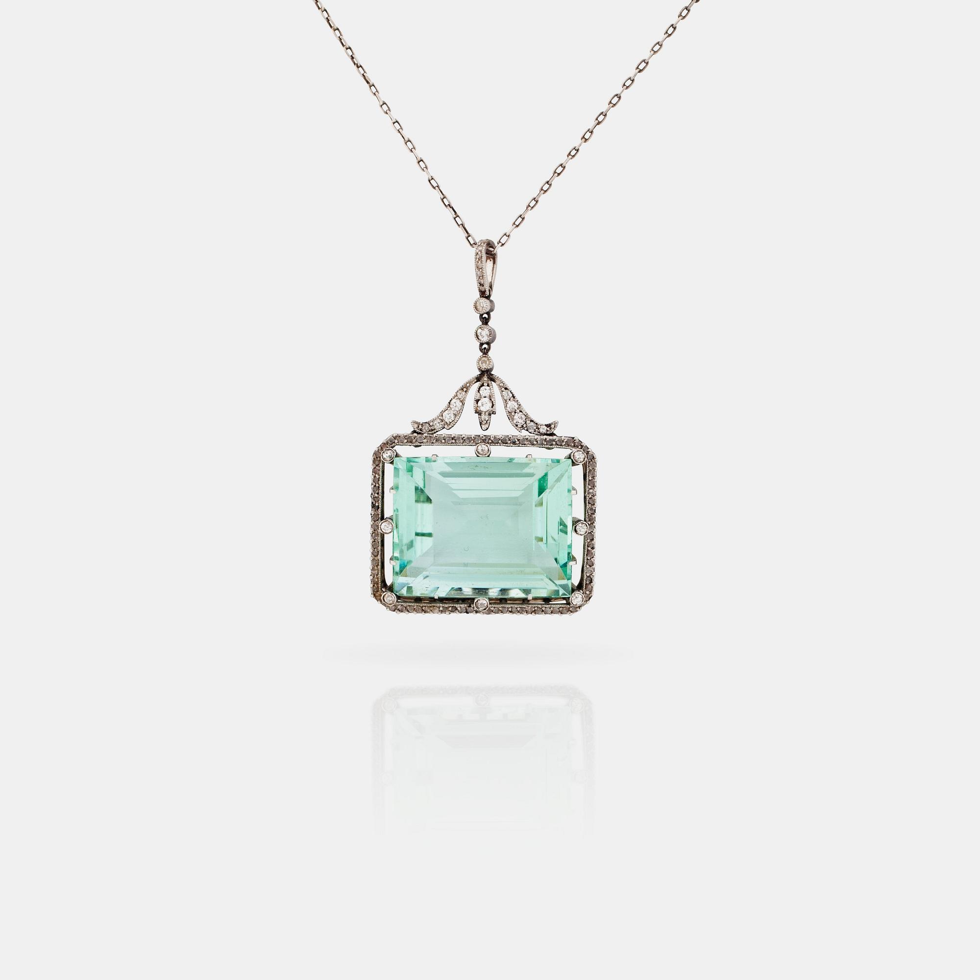 A circa 37.00 ct aquamarine and rose- and old-cut diamond pendant.