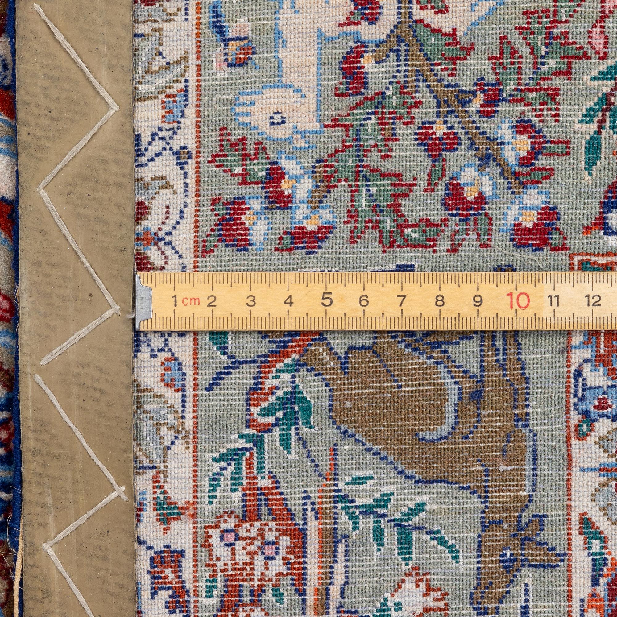 An oriental, figural, signed rug, c. 162 x 104 cm.
