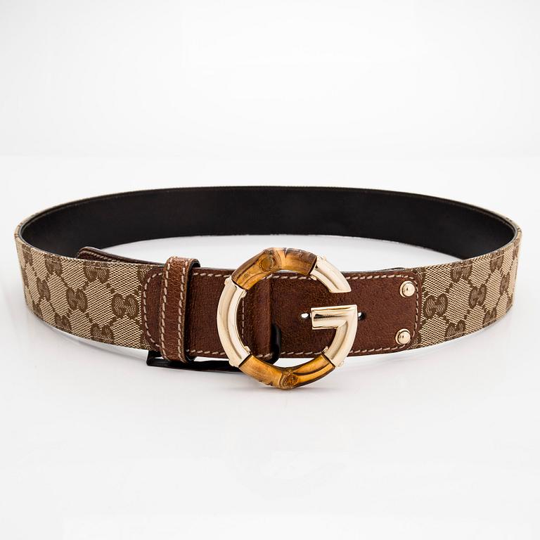 A Gucci monogram canvas leather belt.