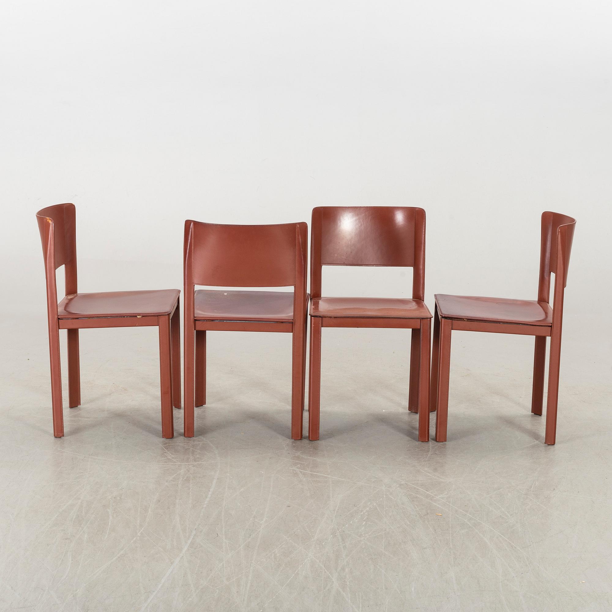 MATTEO GRASSI, a set of four leather chairs.