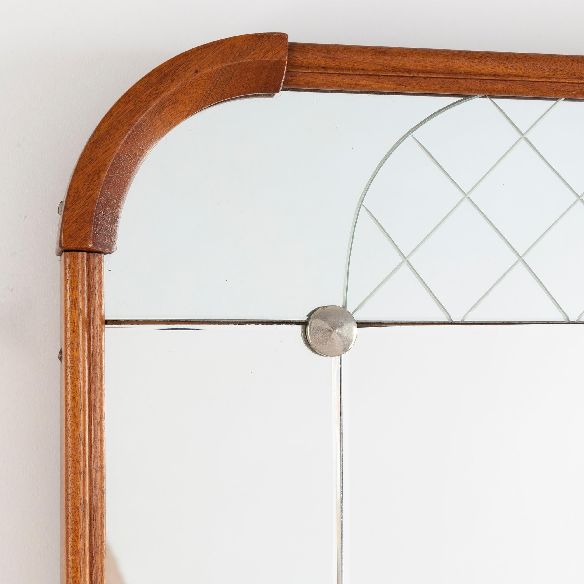 A teak veneered mirror.