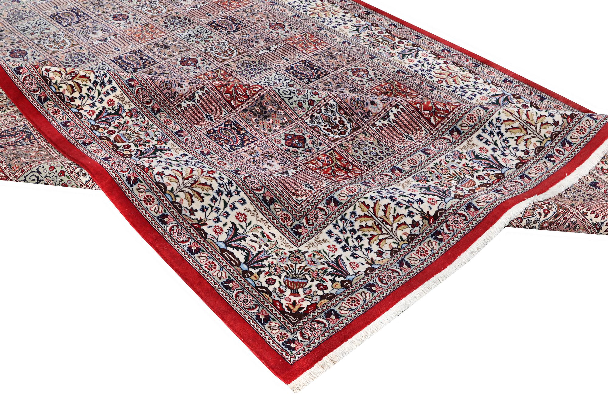A part silk Ghom carpet, c. 346 x 251 cm.