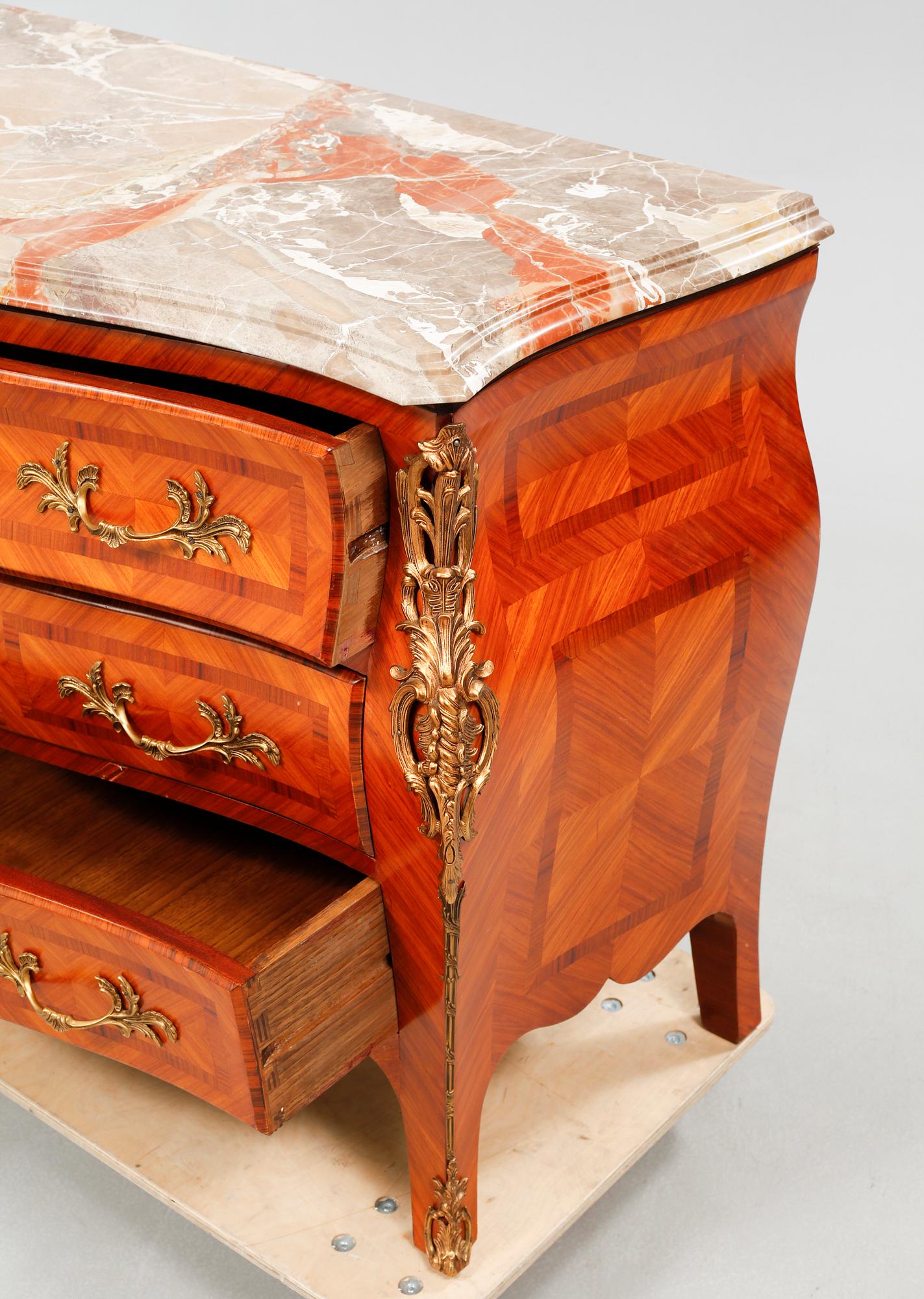 A rococo style chest of drawers, around the mid 20th century.