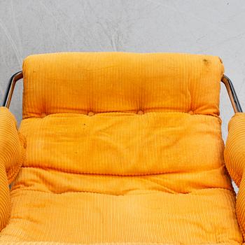 A pair of 1970's 'Luta' easy chairs and foot stools from Värnamo Sängkläder AB.