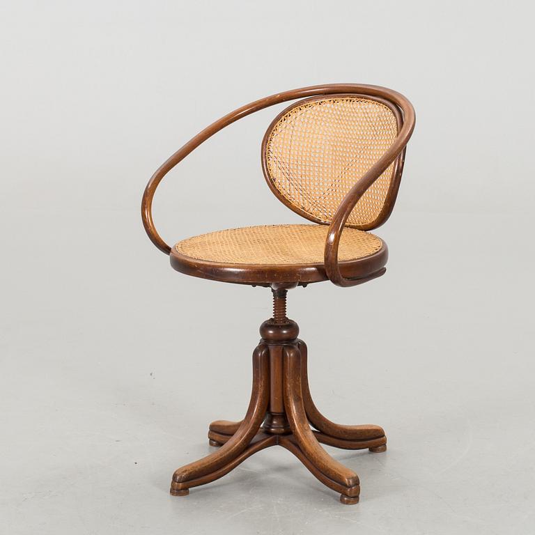 A BENTWOOD DESK CHAIR.