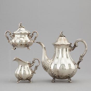 A silver coffee pot, creamer and sugar bowl, swedish import mark.