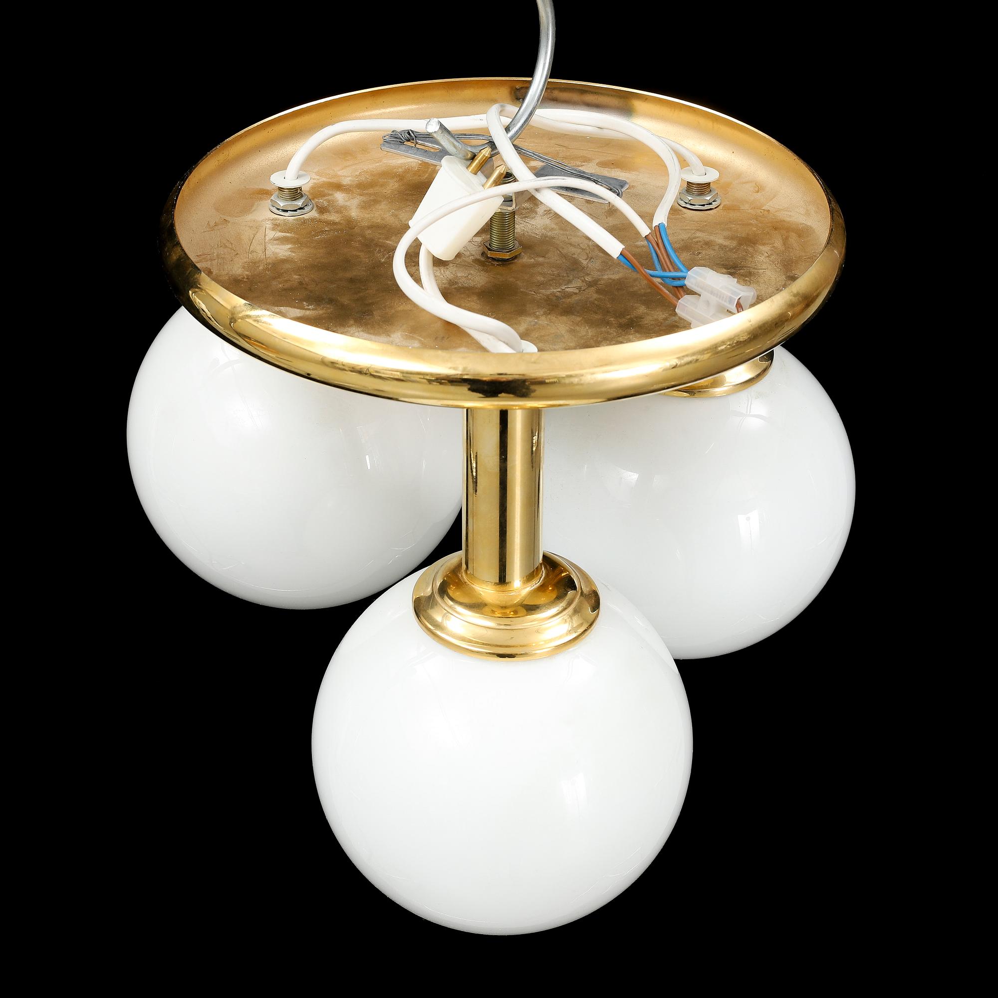 A contemporary brass and glass ceiling light.