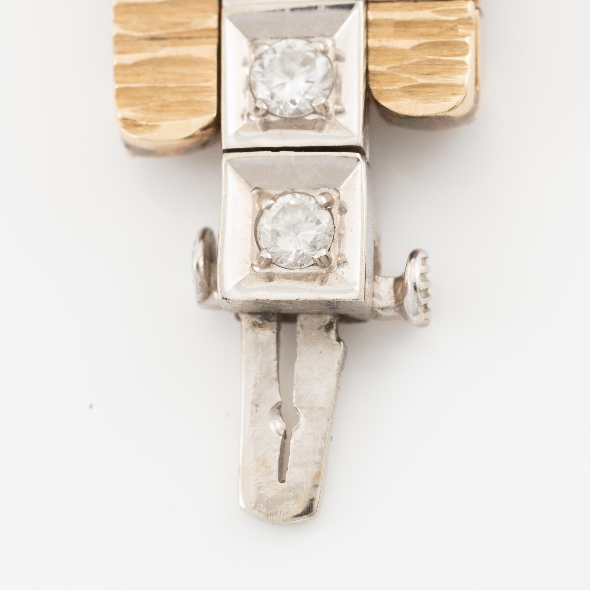 Bracelet in 14K gold and white gold with brilliant-cut diamonds.