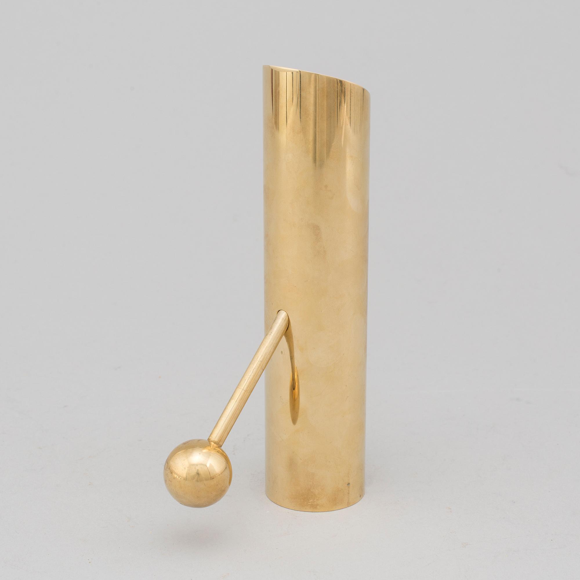 A brass candle holder by Pierre Forssell for Skultuna.