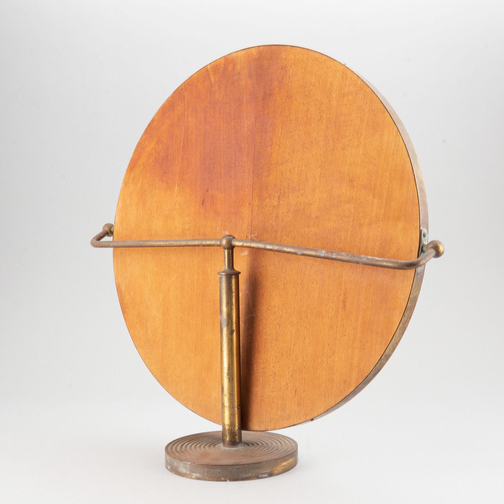 A model 2214 brass table mirror by Josef Frank for Firma Svenskt Tenn.