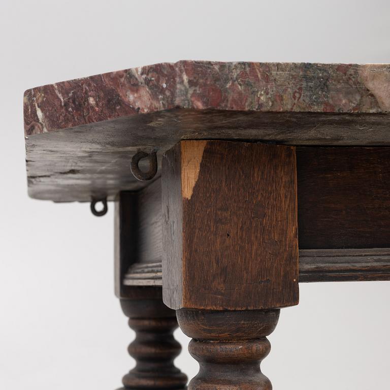 A 19th century Baroque style stone-top table.