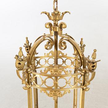 A 20th century brass ceiling lamp in Louis XV-style.