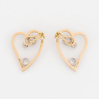 WA Bolin a pair of earrings in 18K gold and white gold set with round brilliant-cut diamonds.