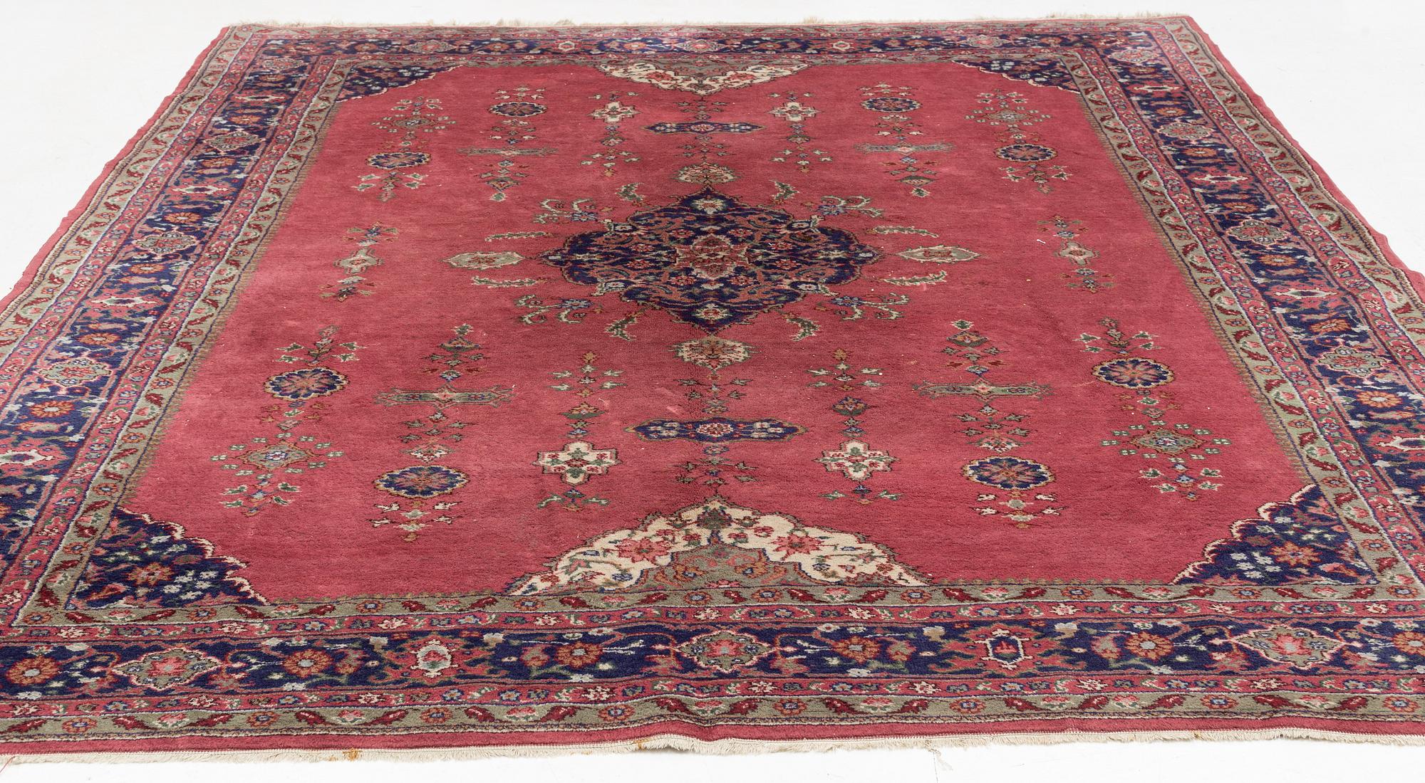 An oriental/eastern European carpet, c. 355 x 275 cm.
