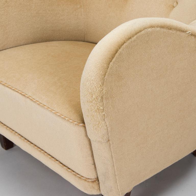 A pair of mid-20th century armchairs.