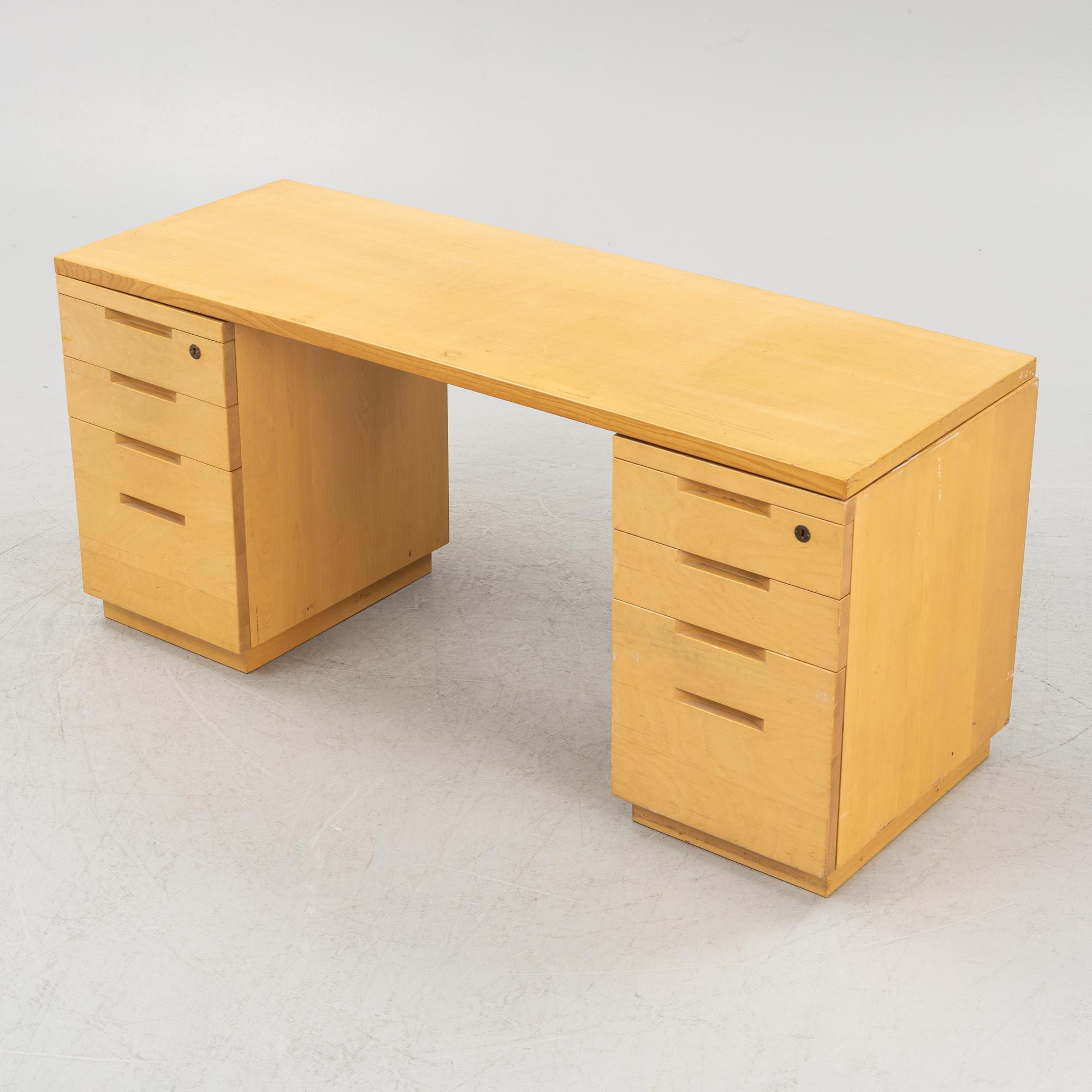 Alvar Aalto, a birch writing desk for Artek, Finland, second half of the 20th century.