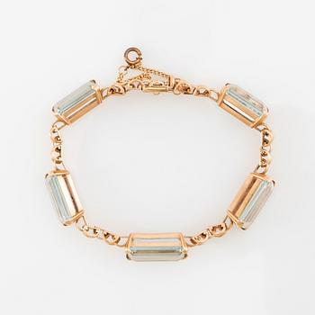 Bracelet 18K gold with step-cut aquamarines.
