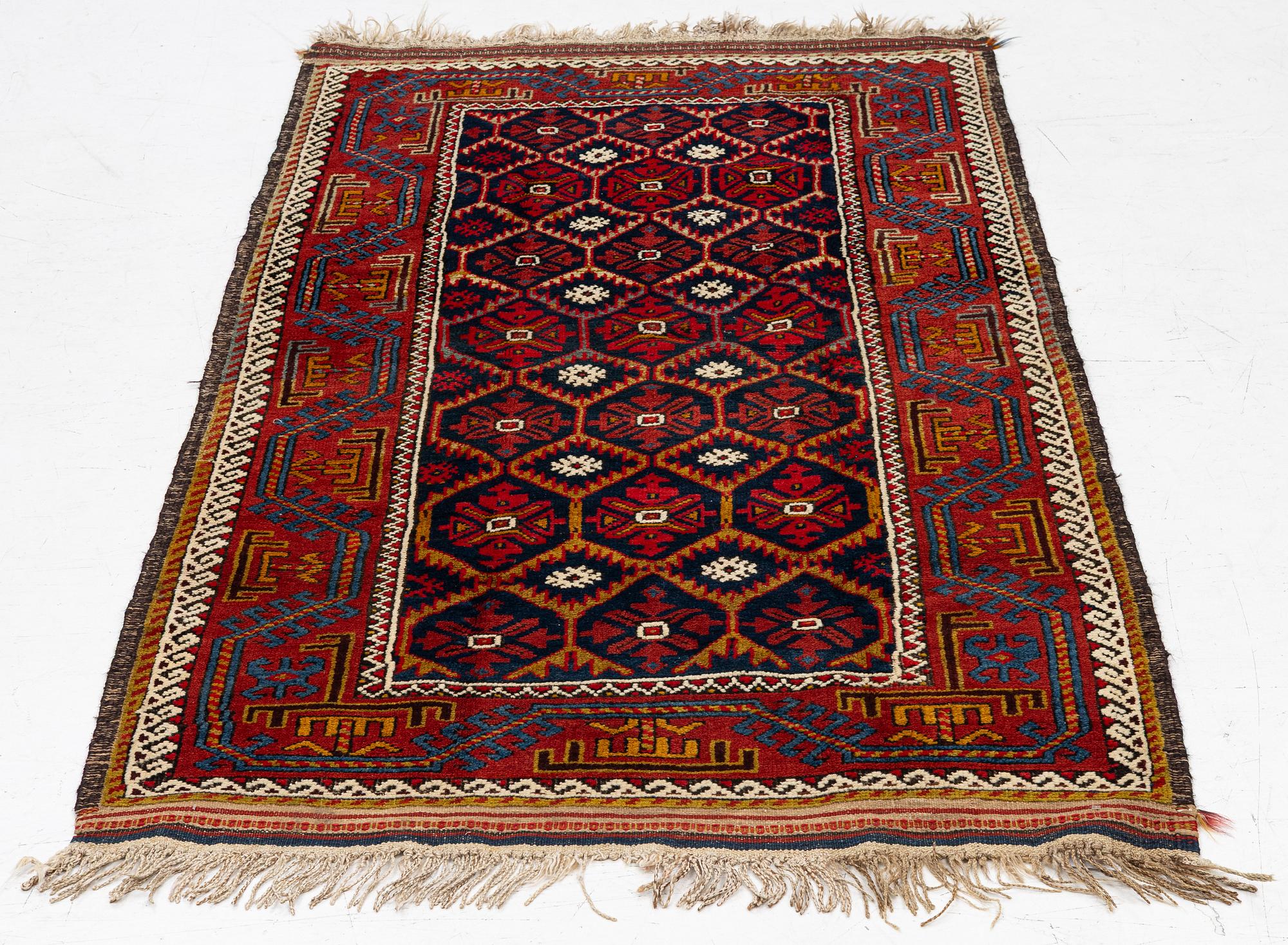 An antique Baluch rug, east Persian, ca 203 x 101 cm.