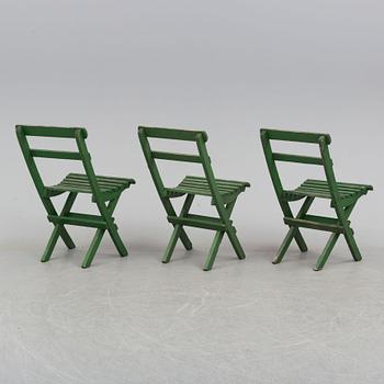 A garden table and three chairs.