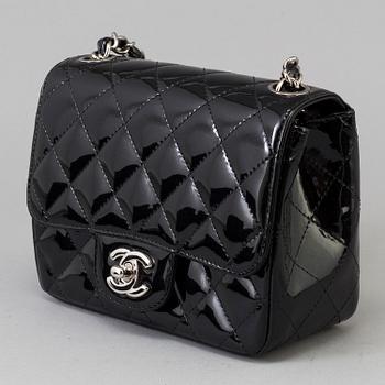 A black lacquer "Classic mini" bag by Chanel 2009-2010.