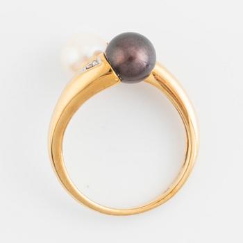 Gold and two cultured pearl and brilliant cut diamond cross over ring.
