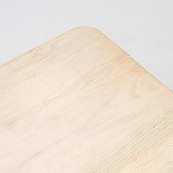 A steel and oak table by Jonas Lindvall 2011.