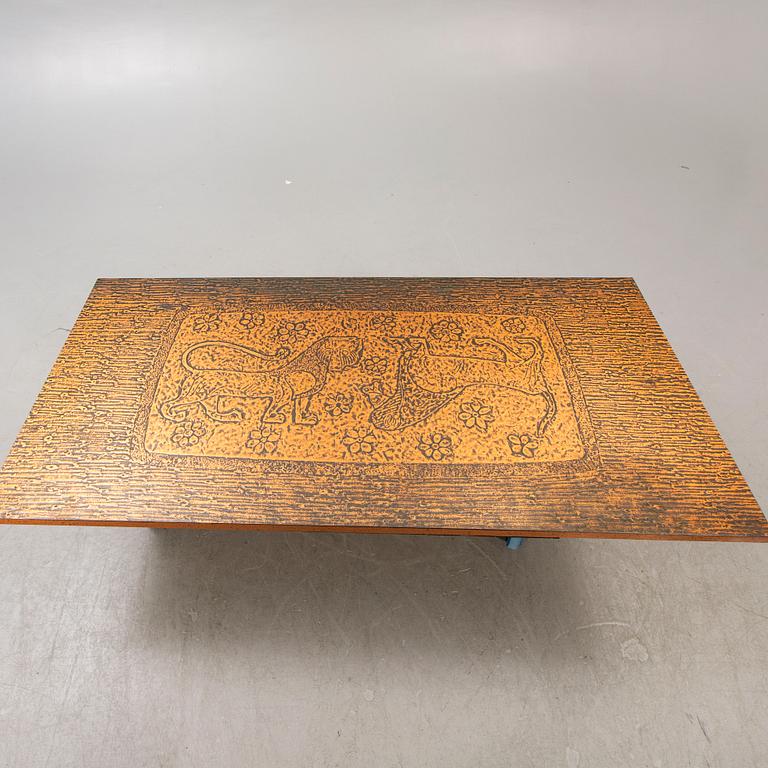 A 1970s copper coffee table.