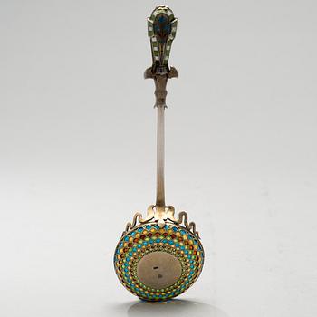 A SPOON, silver and enamel, egyptique revival, 1920s.