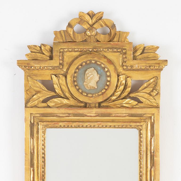 A Gustavian style mirror by John Lundmark, 20th Century.