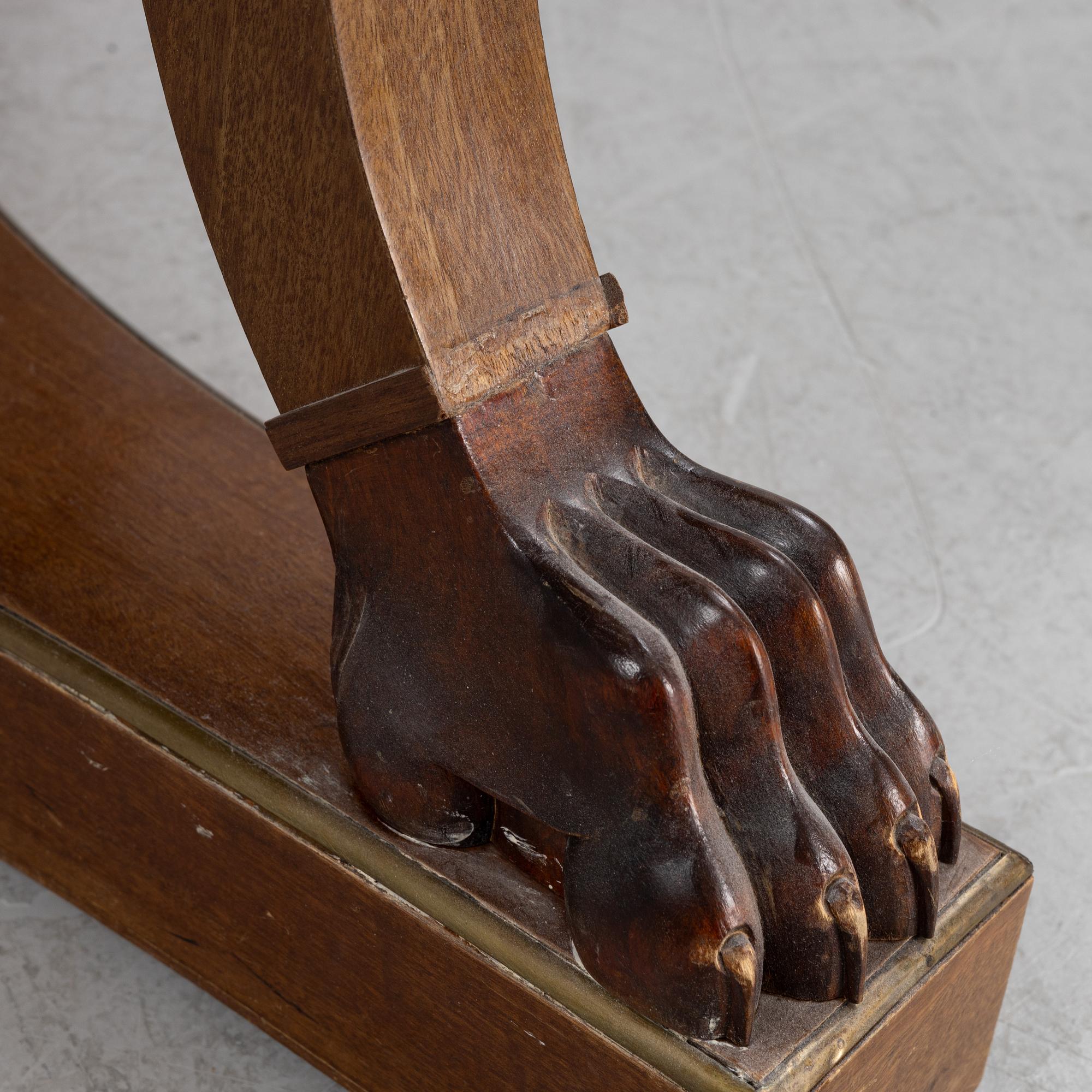 A mahogany veneered Empire style table, first half the 20th Century.