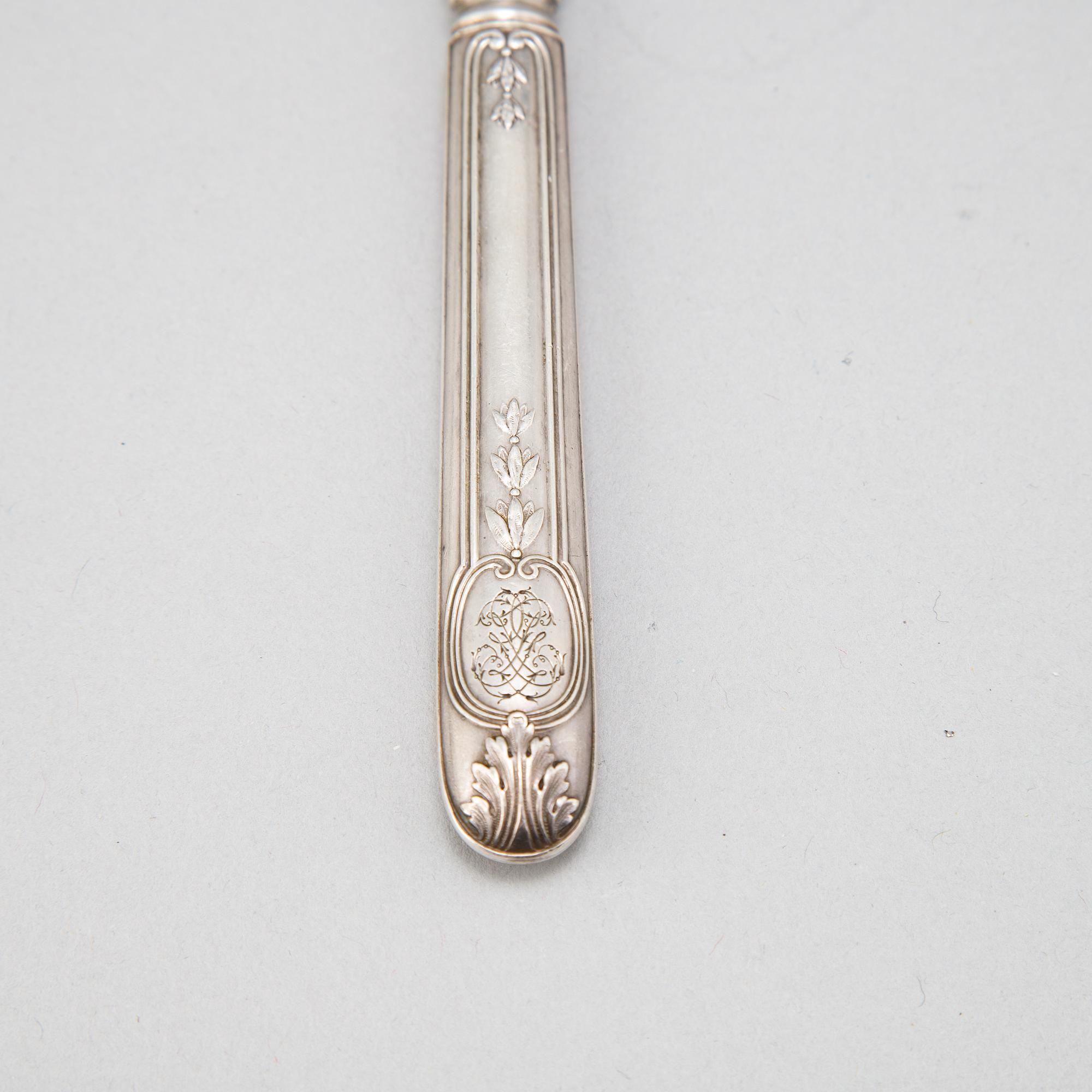 A set of twelve French 19th century silver lobster forks.