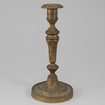 A late 18th century bronze candlestick.