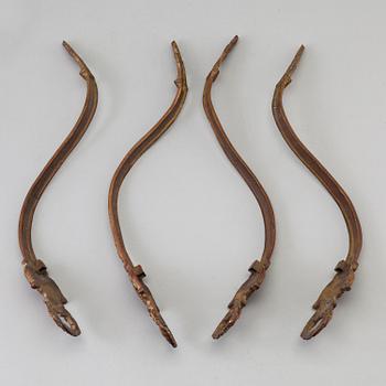 SEVEN BRONZE CURTAIN TIE-BACKS (4+3), 19th century.