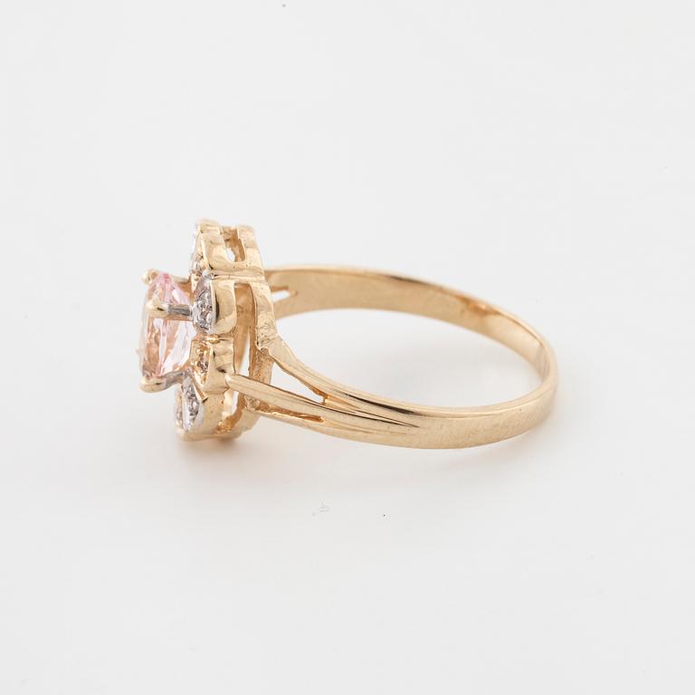 A morganite and brilliant cut diamond ring.