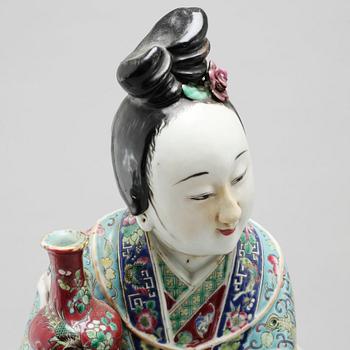 A porcelain figurine from China, late 19th or early 20th century.