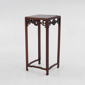 A hardwood side table/pedestal, China, first half of the 20th century.