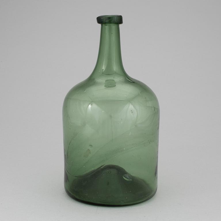 A 18th or 19th century glass bottle.